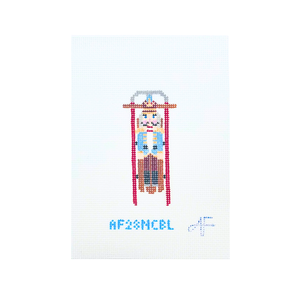 Sled with Blue Nutcracker Needlepoint Canvas